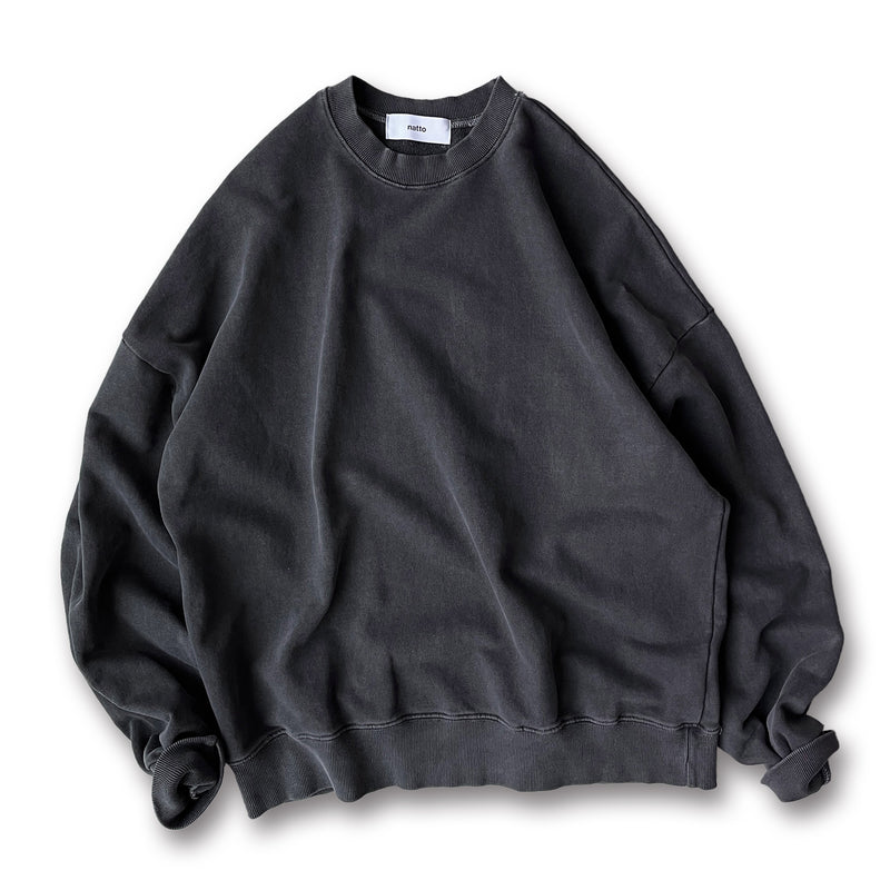 Charcoal washed crewneck sweatshirt showing faded color variation around seams, neck, cuffs, and hem